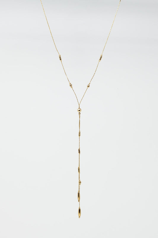 Long Gold Necklance With Golden Beads Throughout and Long Golden Tassle